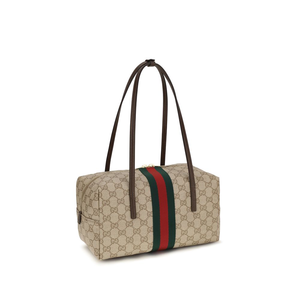 Sac à main Gucci en coton beige, élégant et spacieux, avec détails de design distinctifs et logo Gucci visible.