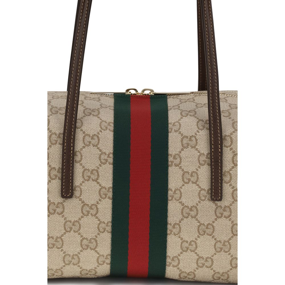 Sac à main en coton beige de la marque Gucci, avec design élégant et détails sophistiqués, visible dans l'image.