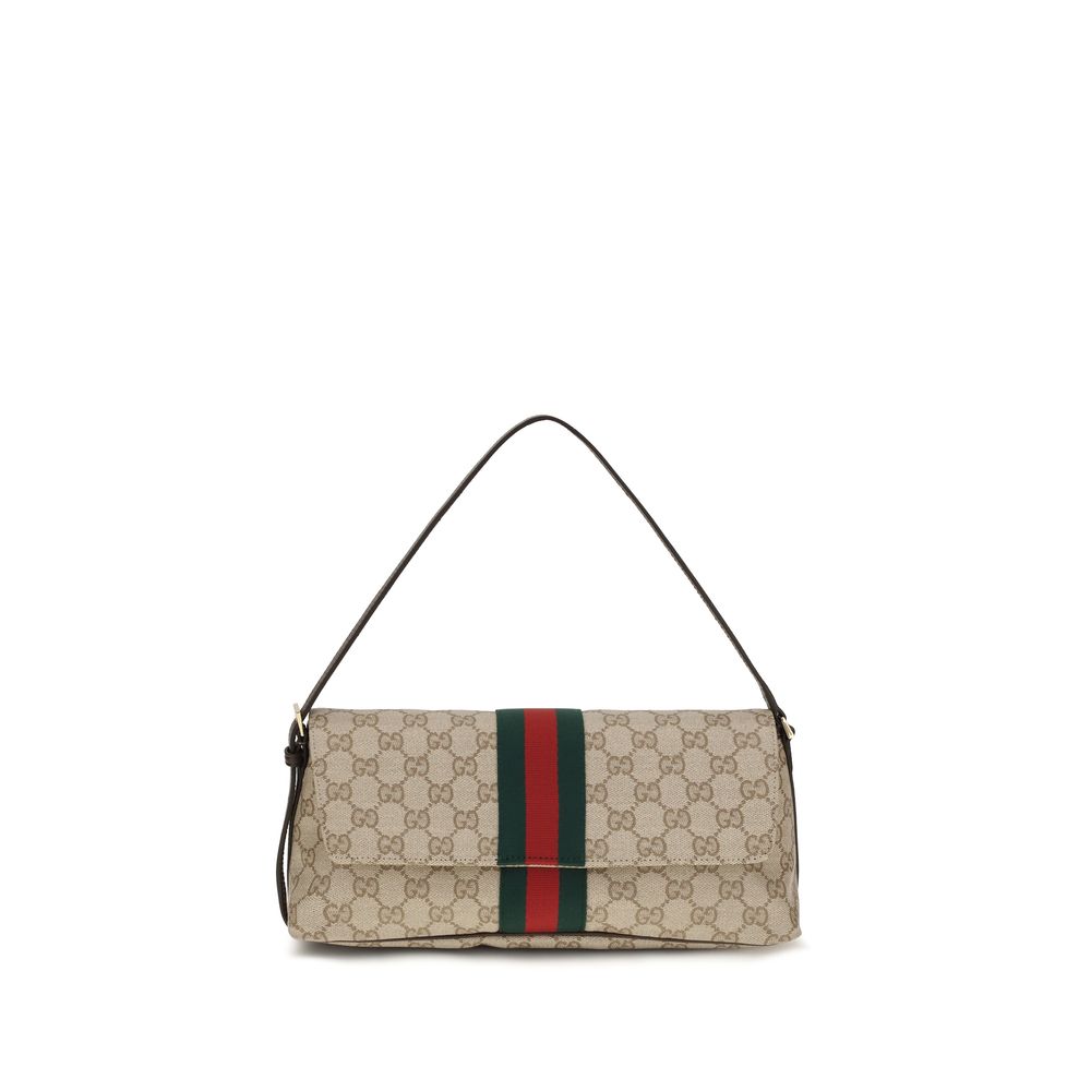 Sac à main beige en coton de Gucci, avec détails élégants, idéal pour un style chic et sophistiqué.