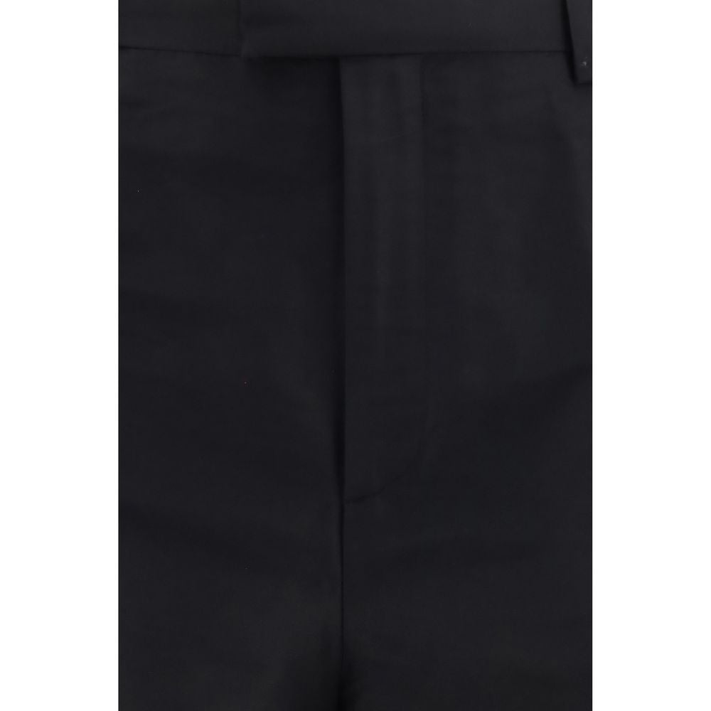 Pantalon de costume en soie noire Gucci pour femme, élégant et sophistiqué, avec coupe ajustée et finition soignée.
