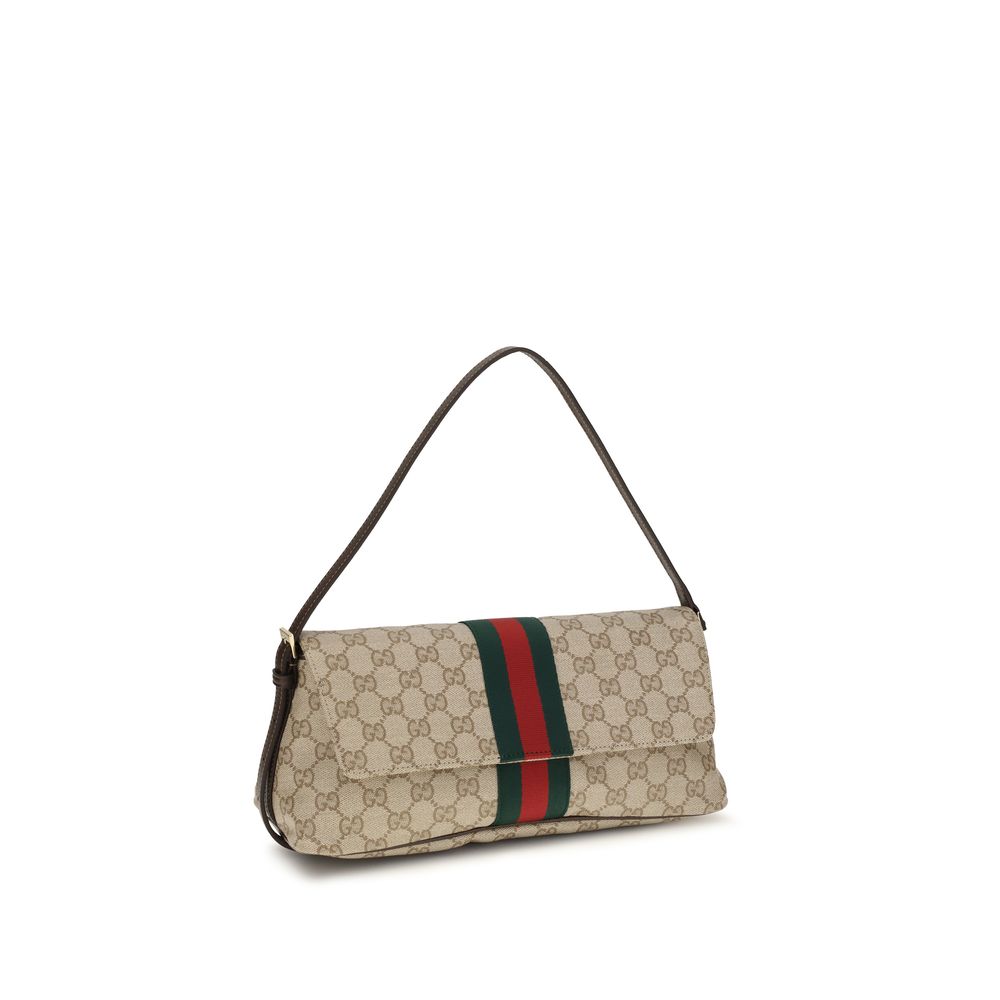 Sac à main Gucci beige en coton avec détails élégants, visible avec poignées et fermeture, idéal pour un style sophistiqué.