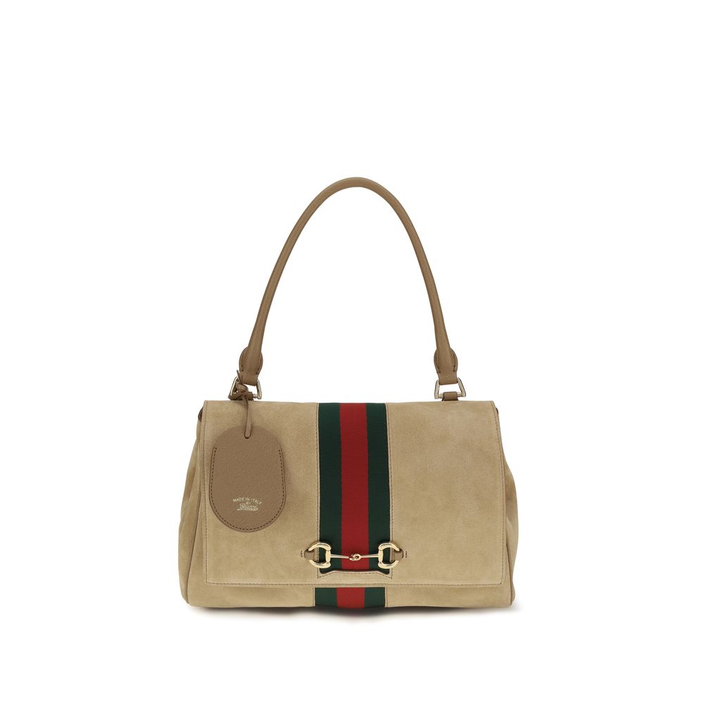 Sac à main Gucci Bos Taurus en cuir de veau beige, avec détails élégants et finition de haute qualité.