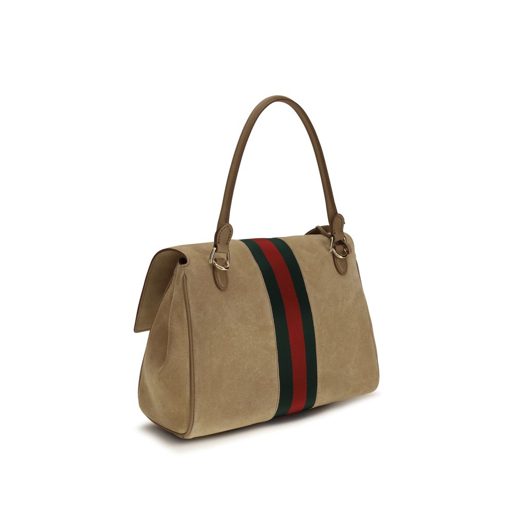 Sac à main Gucci en cuir de veau beige Bos Taurus, avec détails élégants et finition raffinée visible sur l'image.