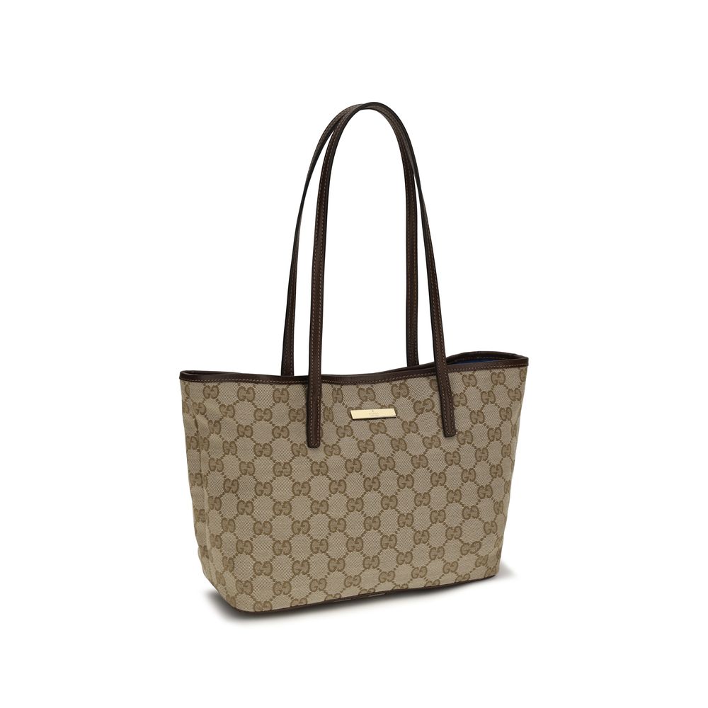 Sac à main en polyester beige Gucci, élégant et spacieux, avec détails de la marque Gucci visible sur la surface.