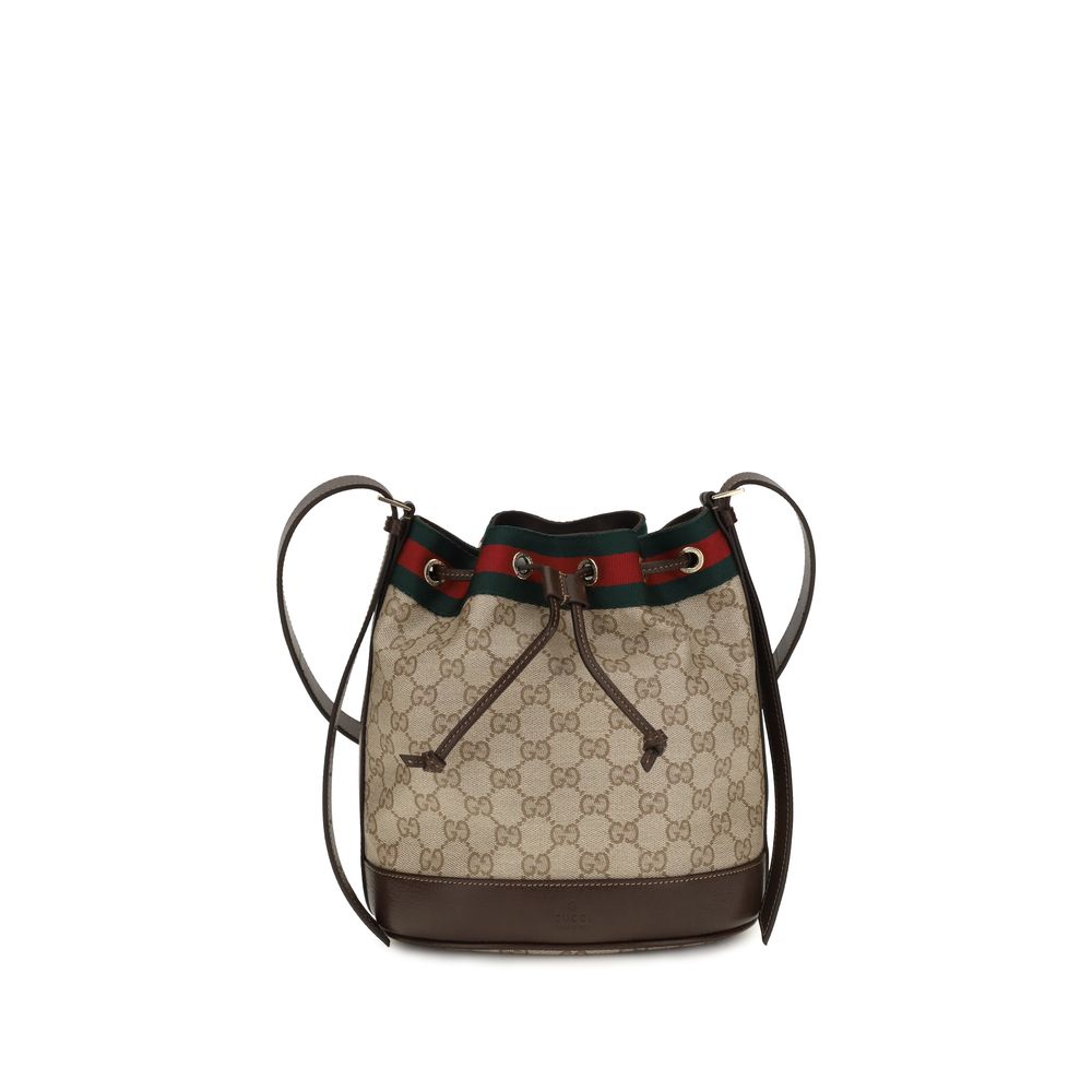 Sac à main en coton beige de la marque Gucci, avec détails élégants et logo distinctif visible sur le devant.