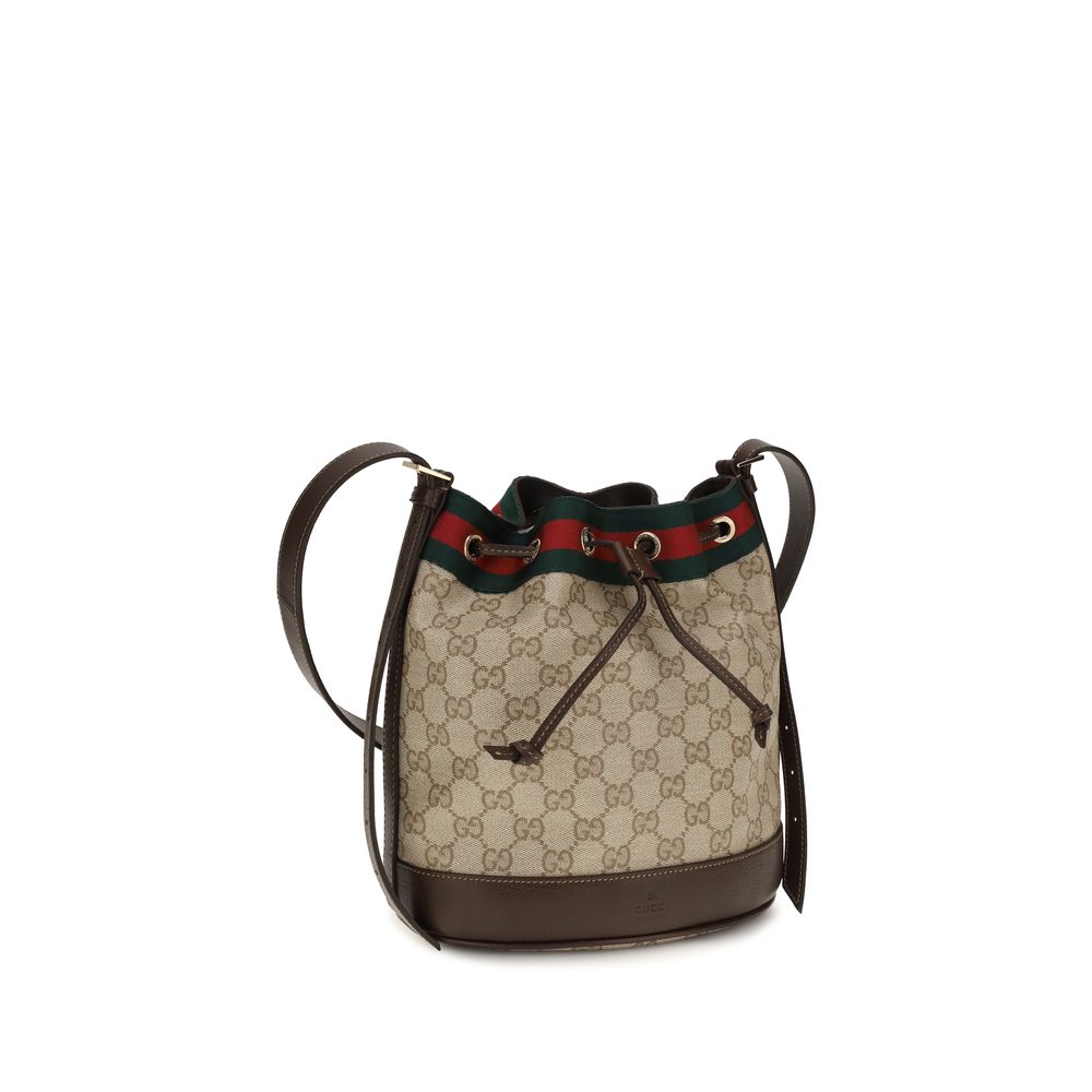 Sac à main en coton beige de Gucci, avec détails élégants et logo emblématique, parfait pour un style sophistiqué.