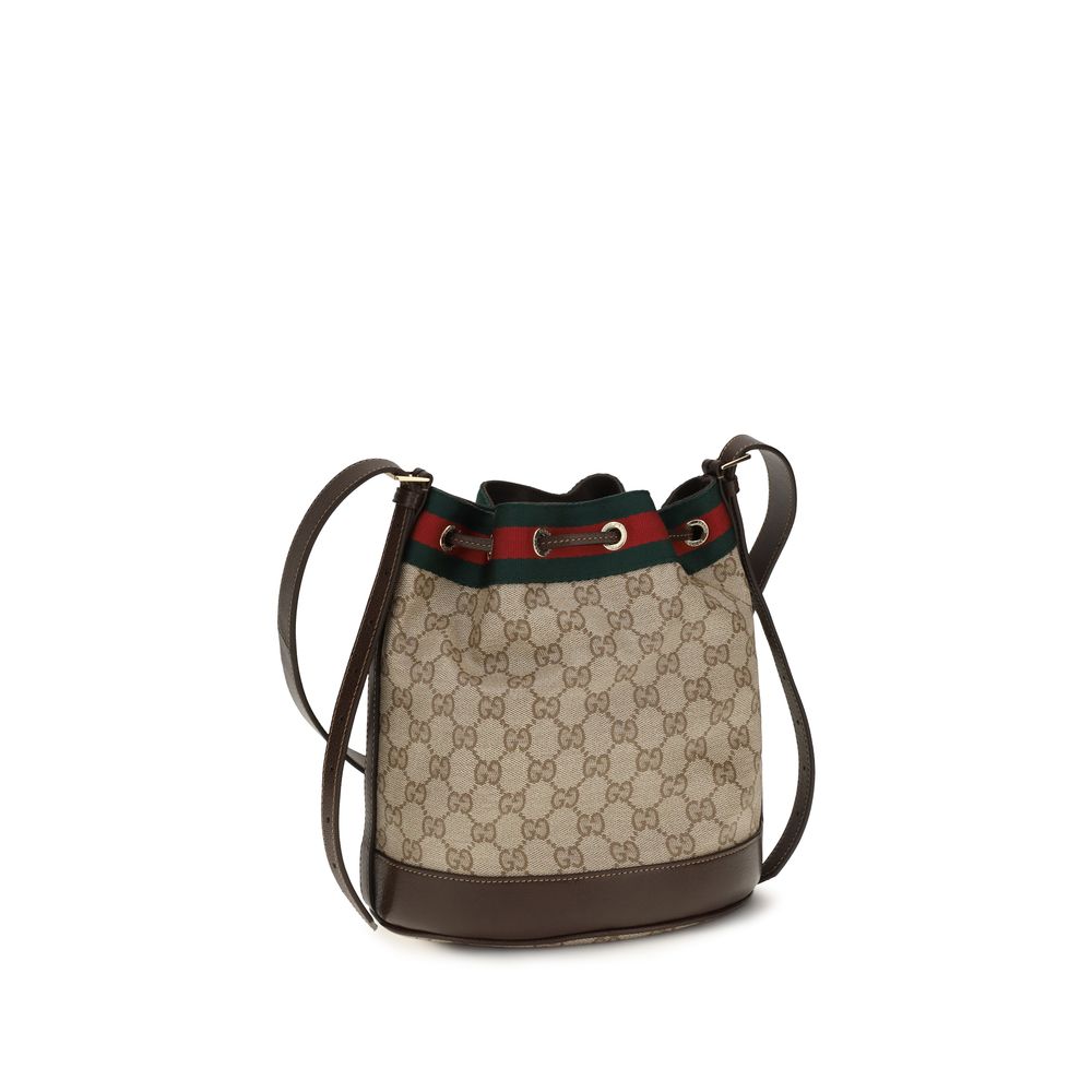 Sac à main en coton beige de Gucci, élégant et spacieux, avec détails en cuir et logo Gucci visible sur le devant.