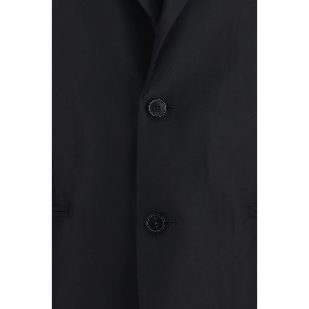 Veste en soie noire Gucci pour femme, détails élégants et coupe sophistiquée, vue de face.