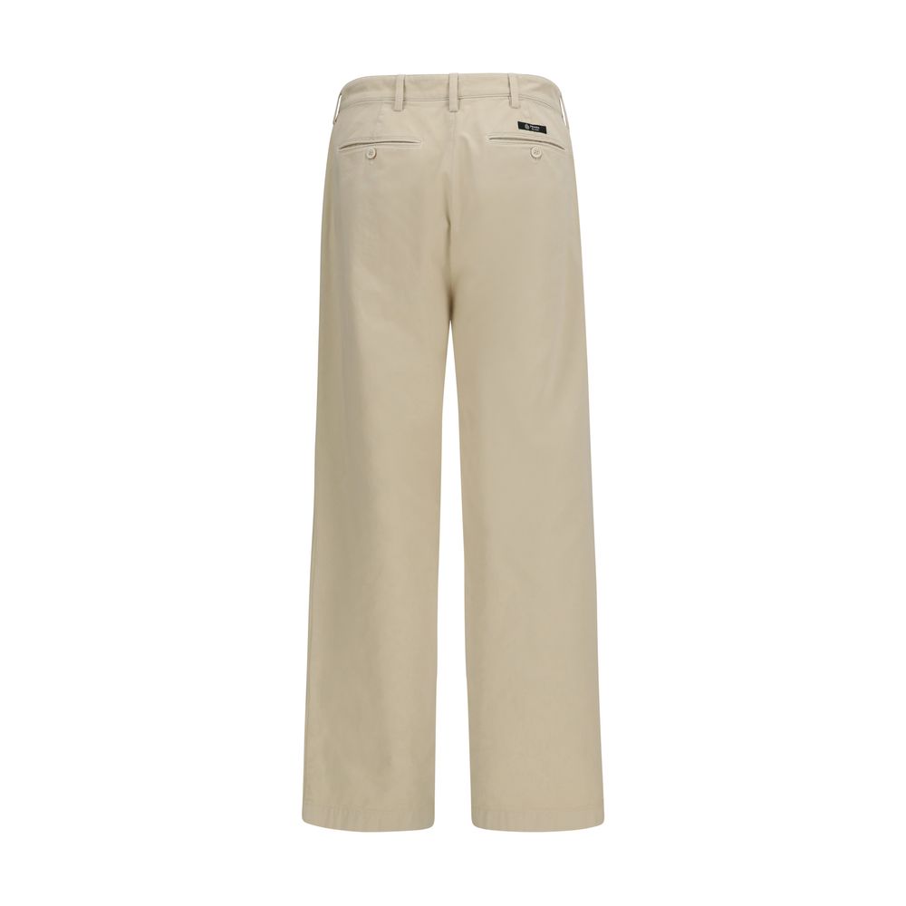 Pantalon beige en coton de style décontracté de Prada, vue de face avec détails de couture et ceinture ajustable.