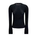 T-shirt en coton noir de Gucci, style décontracté avec logo Gucci visible, porté sur un mannequin.