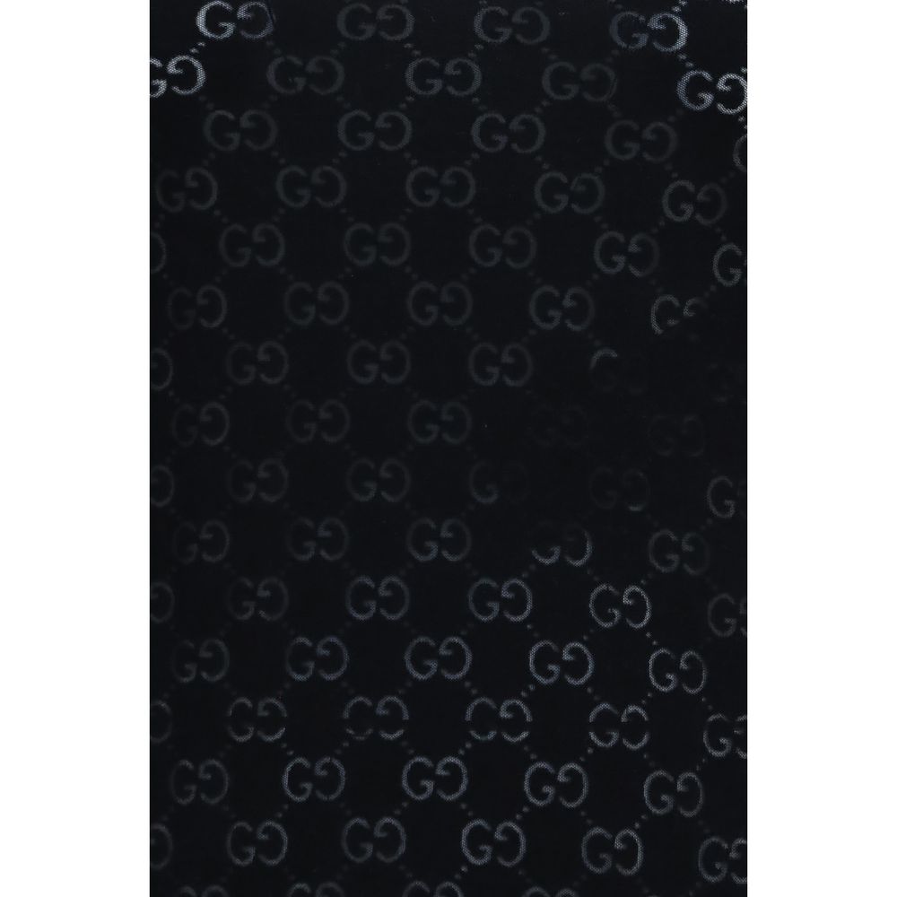 T-shirt en coton noir Gucci pour homme, coupe classique avec logo Gucci visible sur le devant.