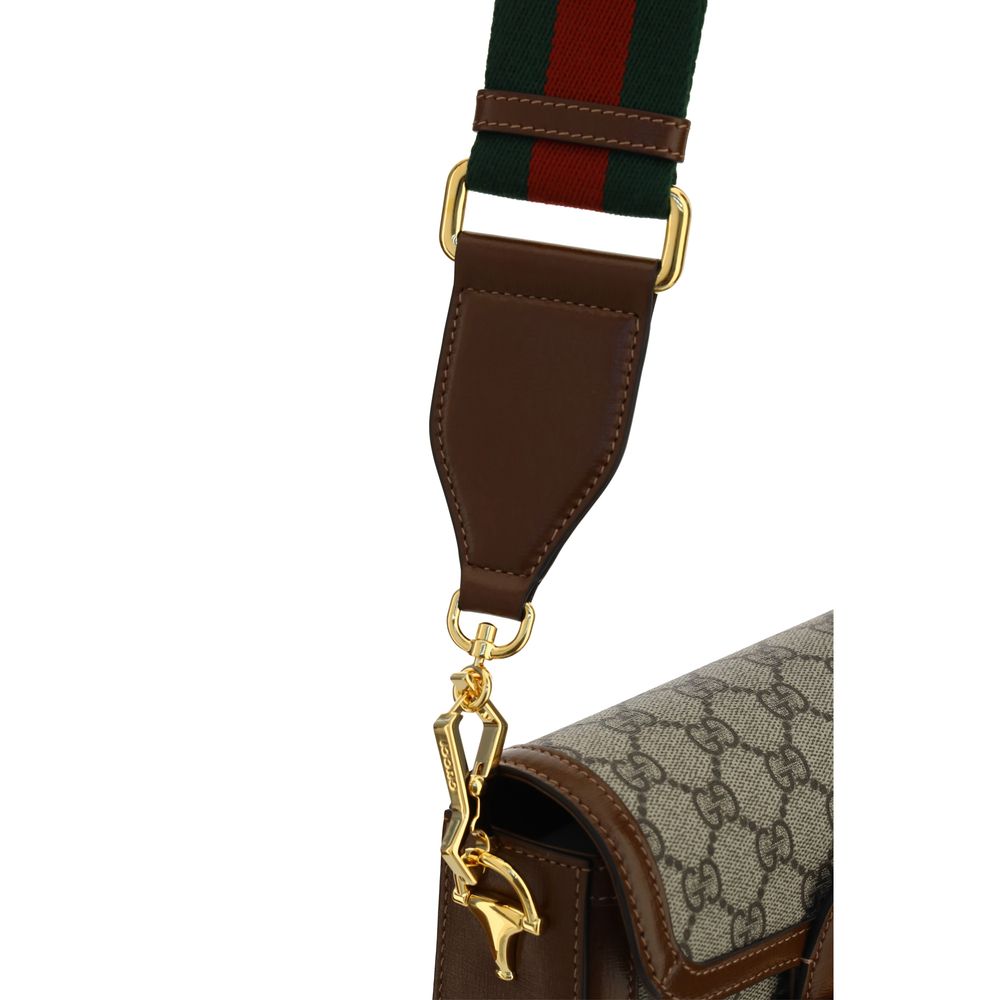 Sac à main Gucci en polyéthylène marron, élégant et moderne, avec design épuré et logo Gucci visible sur le devant.