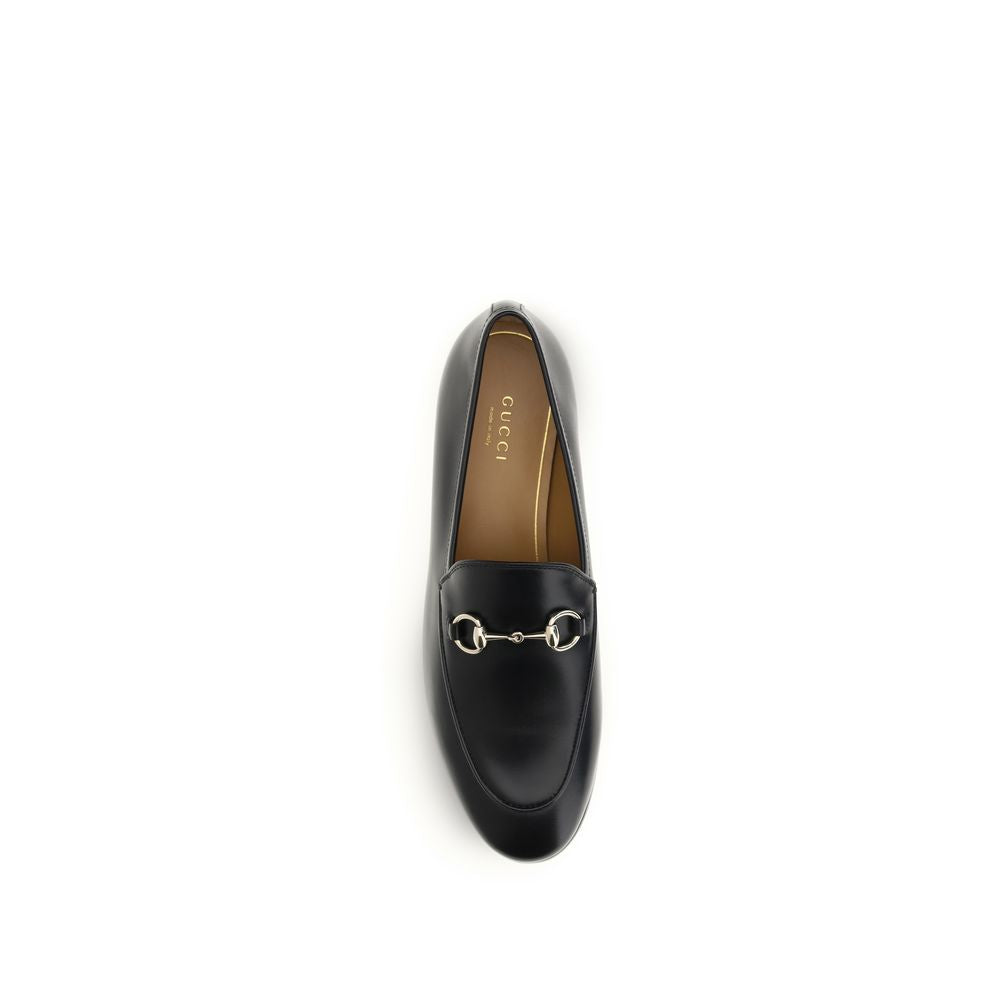 Chaussures Gucci Bos Taurus en cuir de veau noir, mocassins slip-on élégants pour homme, finition de haute qualité.