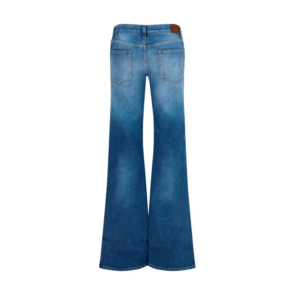 Jeans évasés en coton bleu Gucci, denim avec coupe fluide et détails classiques, pour un style élégant et décontracté.
