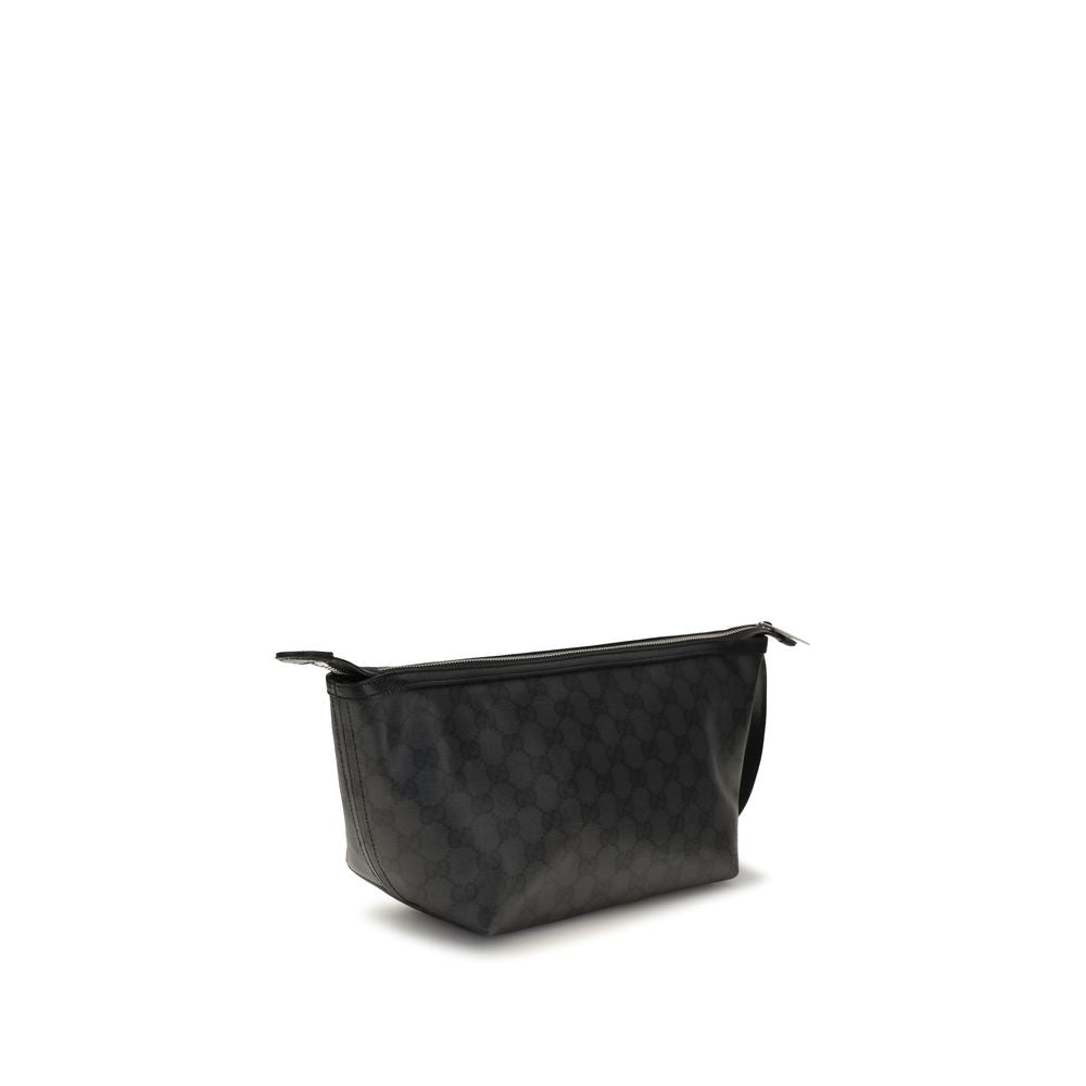 Pochette Gucci en coton noir avec logo emblématique, fermeture élégante et design compact, idéale pour les soirées ou sorties.