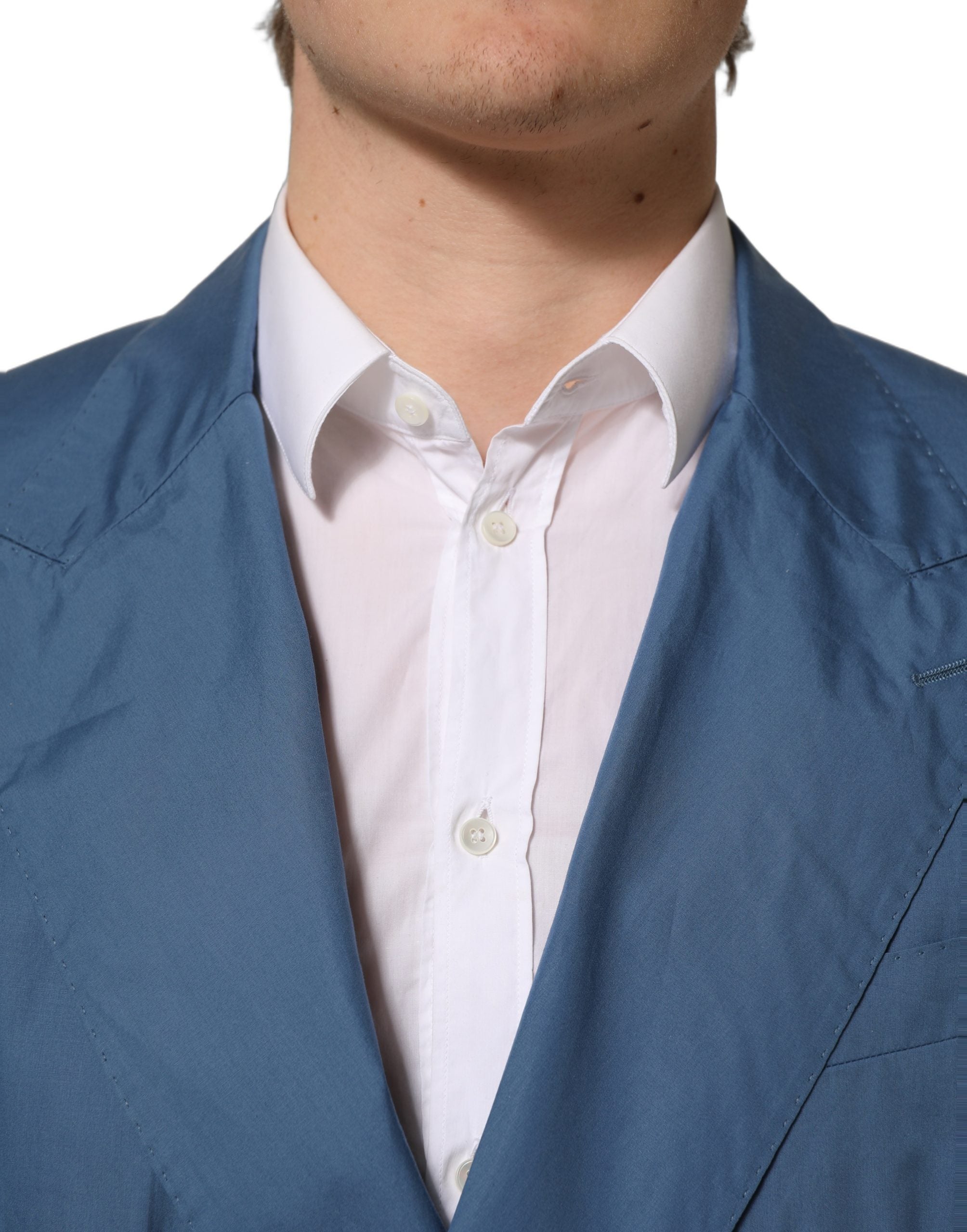 Manteau homme en coton bleu Dolce & Gabbana, coupe double boutonnage, blazer élégant avec col revers et poches frontales.