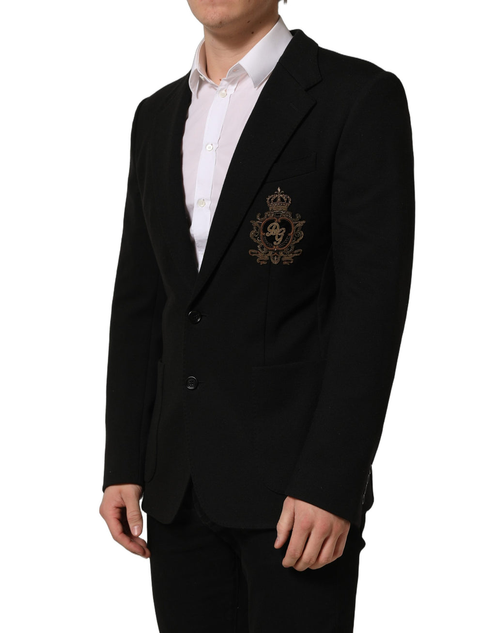 Manteau blazer noir Dolce & Gabbana avec logo en blason, à simple boutonnage, détails élégants et coupe sophistiquée.