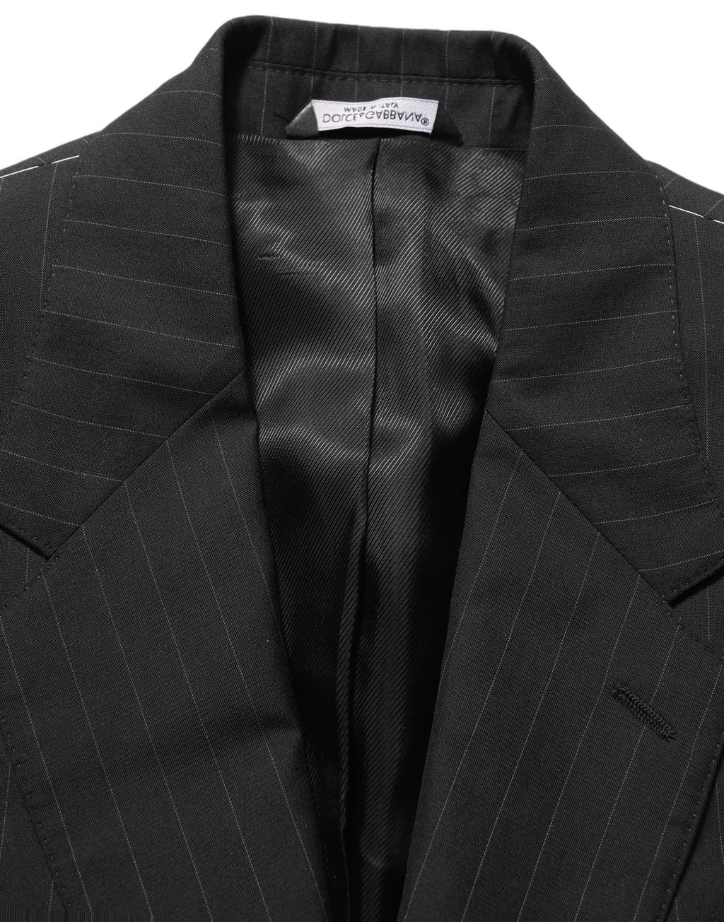 Veste en laine noire à rayures Dolce & Gabbana, blazer à simple boutonnage avec col classique et poches latérales.