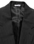 Veste en laine noire à rayures Dolce & Gabbana, blazer à simple boutonnage avec col classique et poches latérales.