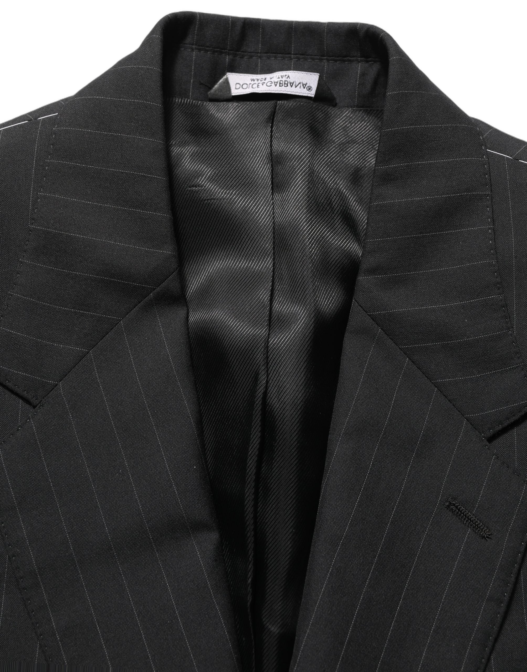 Veste en laine noire à rayures Dolce & Gabbana, blazer à simple boutonnage avec col classique et poches latérales.