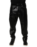 Pantalon homme noir en cuir synthétique avec fermeture éclair, style élégant de Dolce & Gabbana.