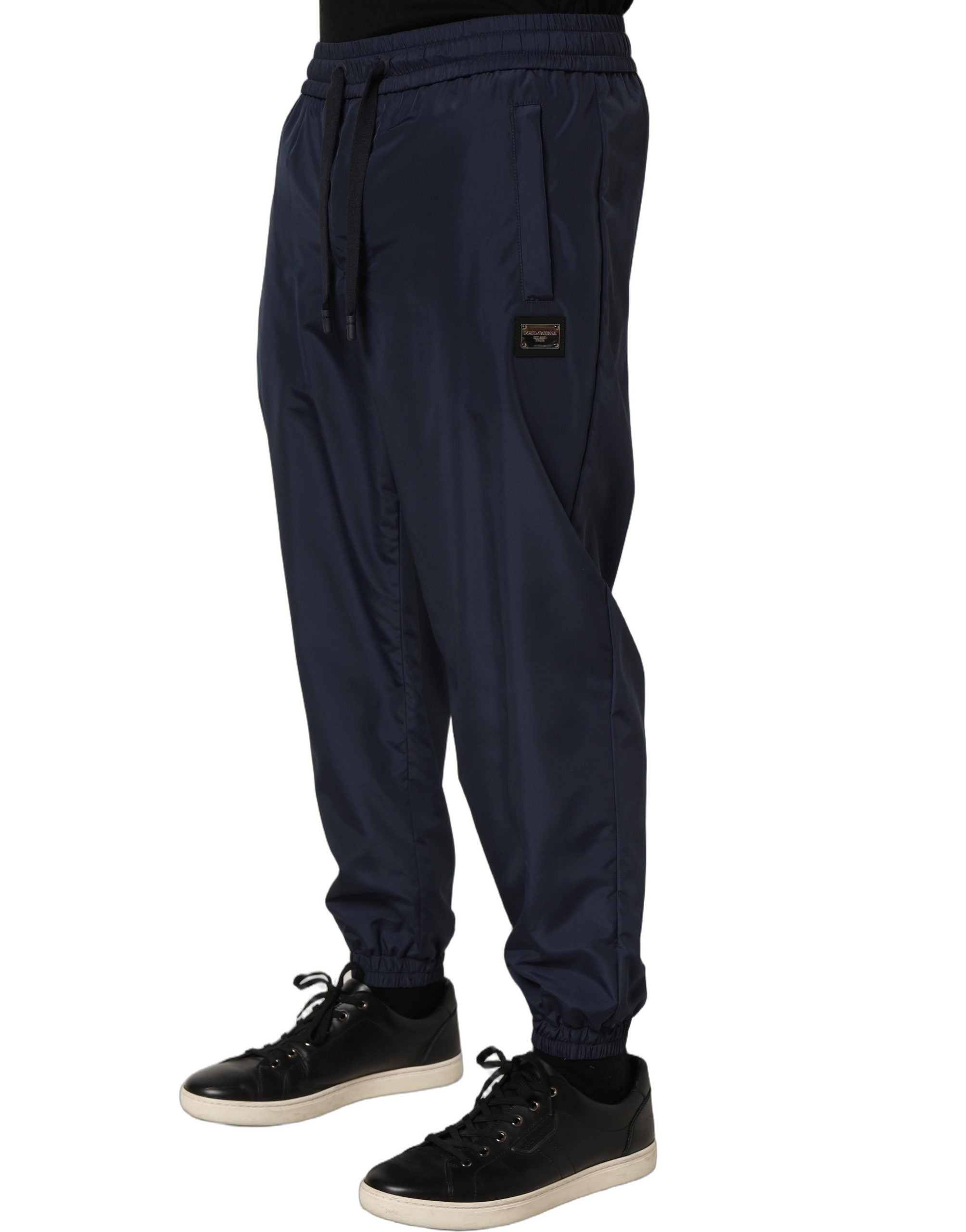 Pantalon de jogging en polyester bleu foncé Dolce & Gabbana, style décontracté avec taille élastique et poches latérales.