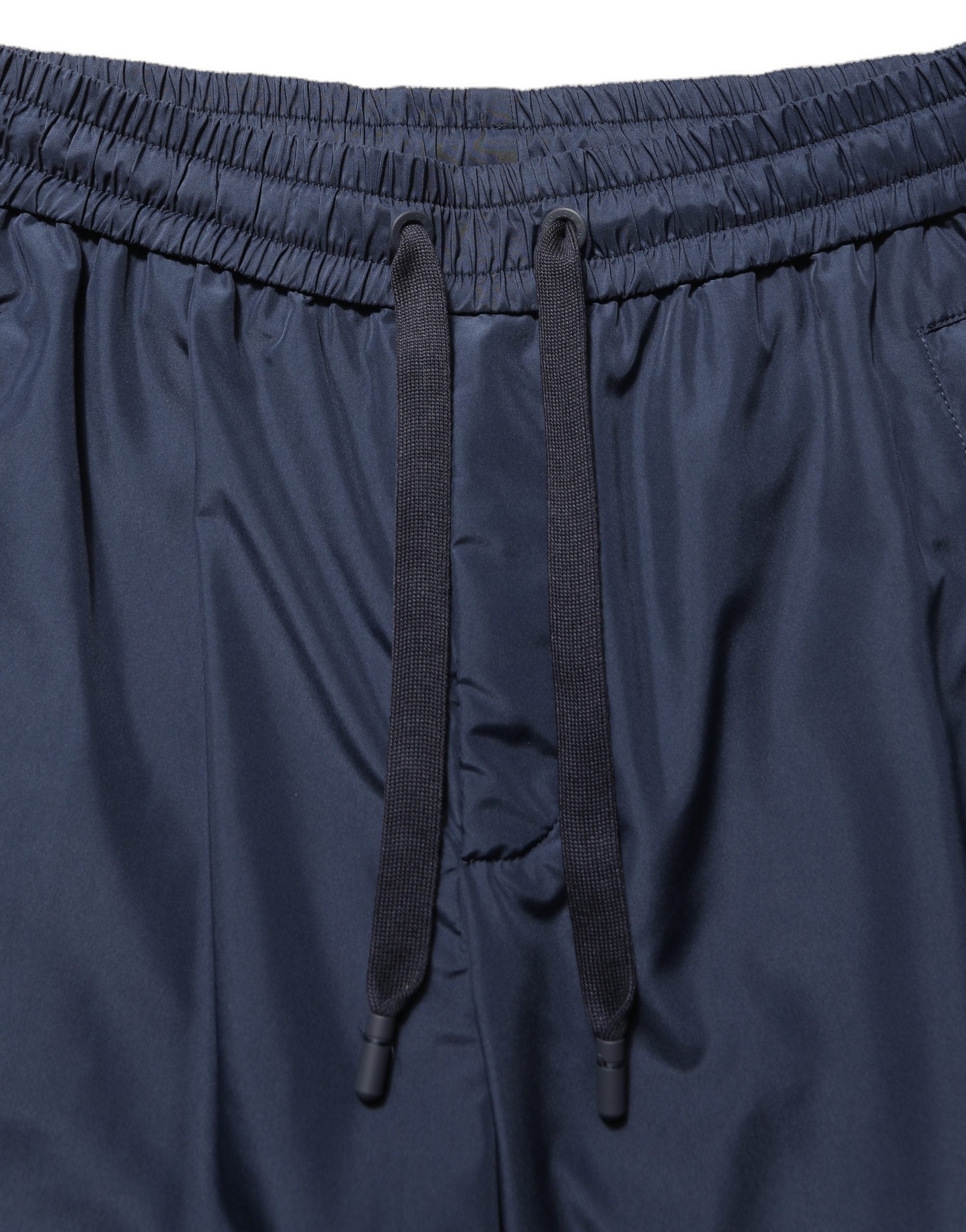 Pantalon jogging en polyester bleu foncé de Dolce & Gabbana, pantalon décontracté pour homme, avec taille élastique et poches latérales.