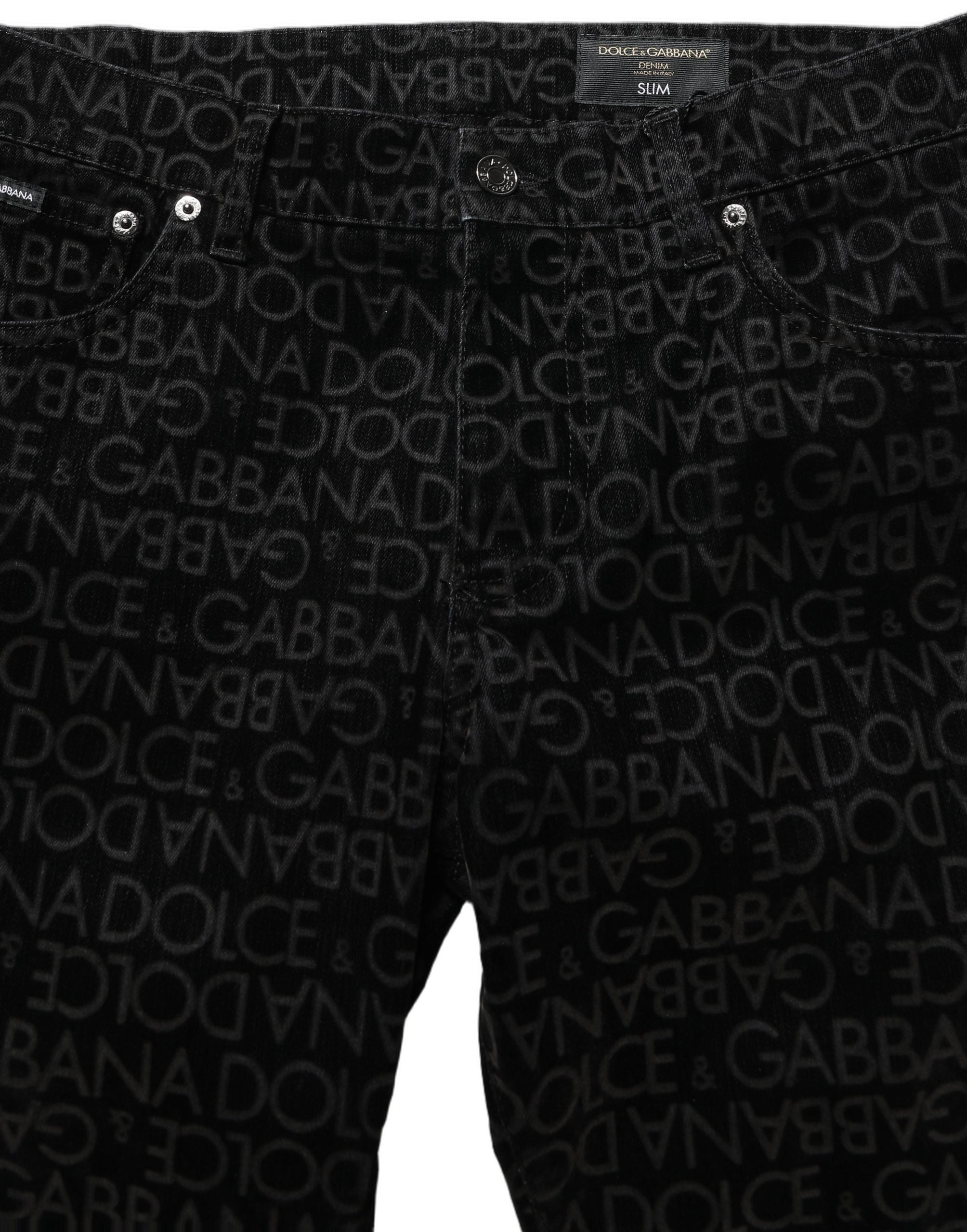 Jeans slim en denim noir Dolce & Gabbana avec logo monogramme en coton, coupe ajustée, détails élégants.
