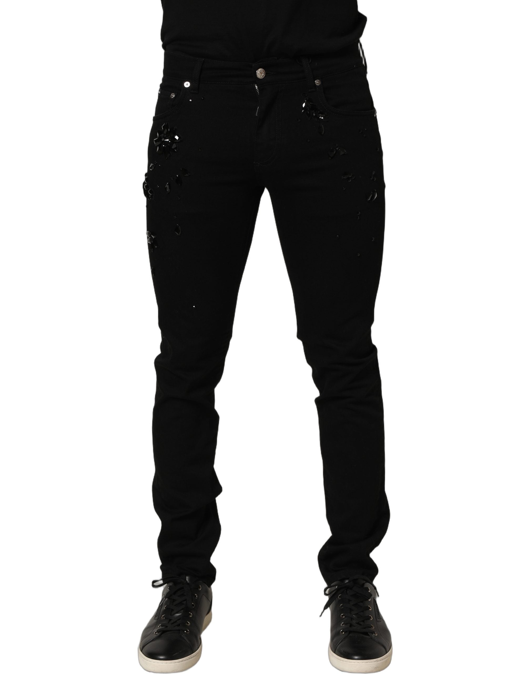 Jeans skinny en denim noir Dolce & Gabbana avec embellissements en coton, visible détails et finition élégante.
