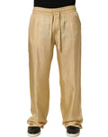Pantalon chino en soie jaune Dolce & Gabbana, coupe droite, taille mi-haute, visible en détail sur la photo.