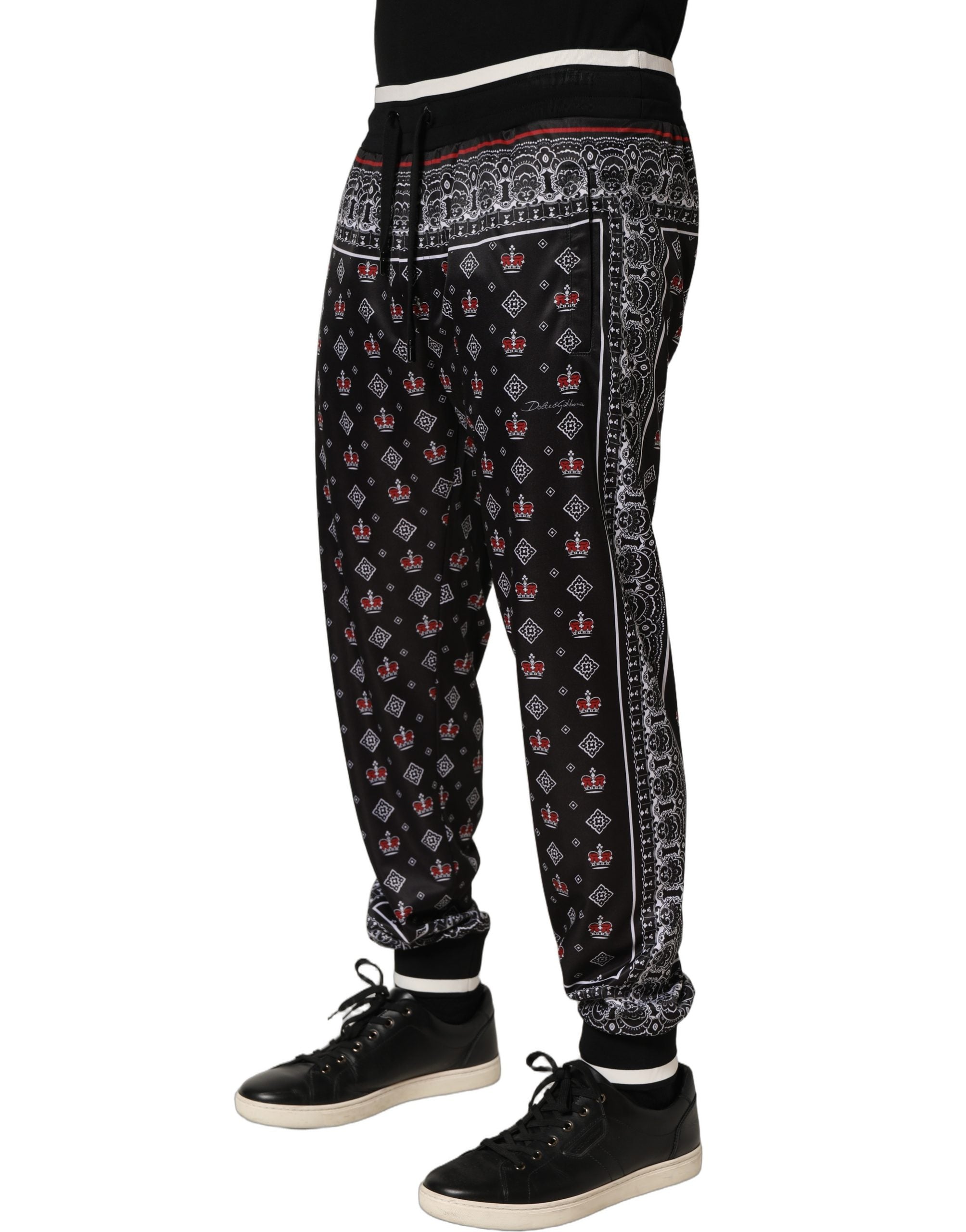 Pantalon jogger noir Dolce & Gabbana pour homme avec bande de couronne, style décontracté et tendance.