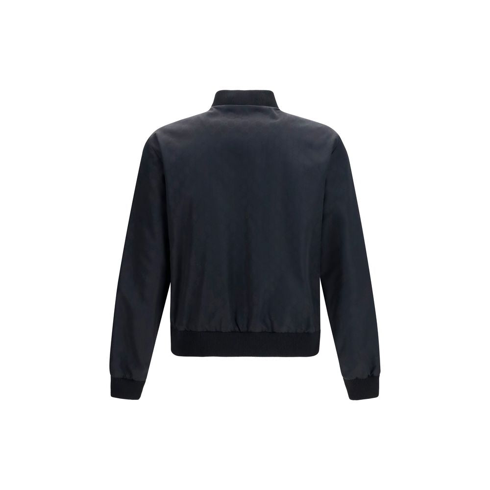 Veste bomber noire en polyamide de Gucci, style moderne avec détails tendance, vue de face sur fond neutre