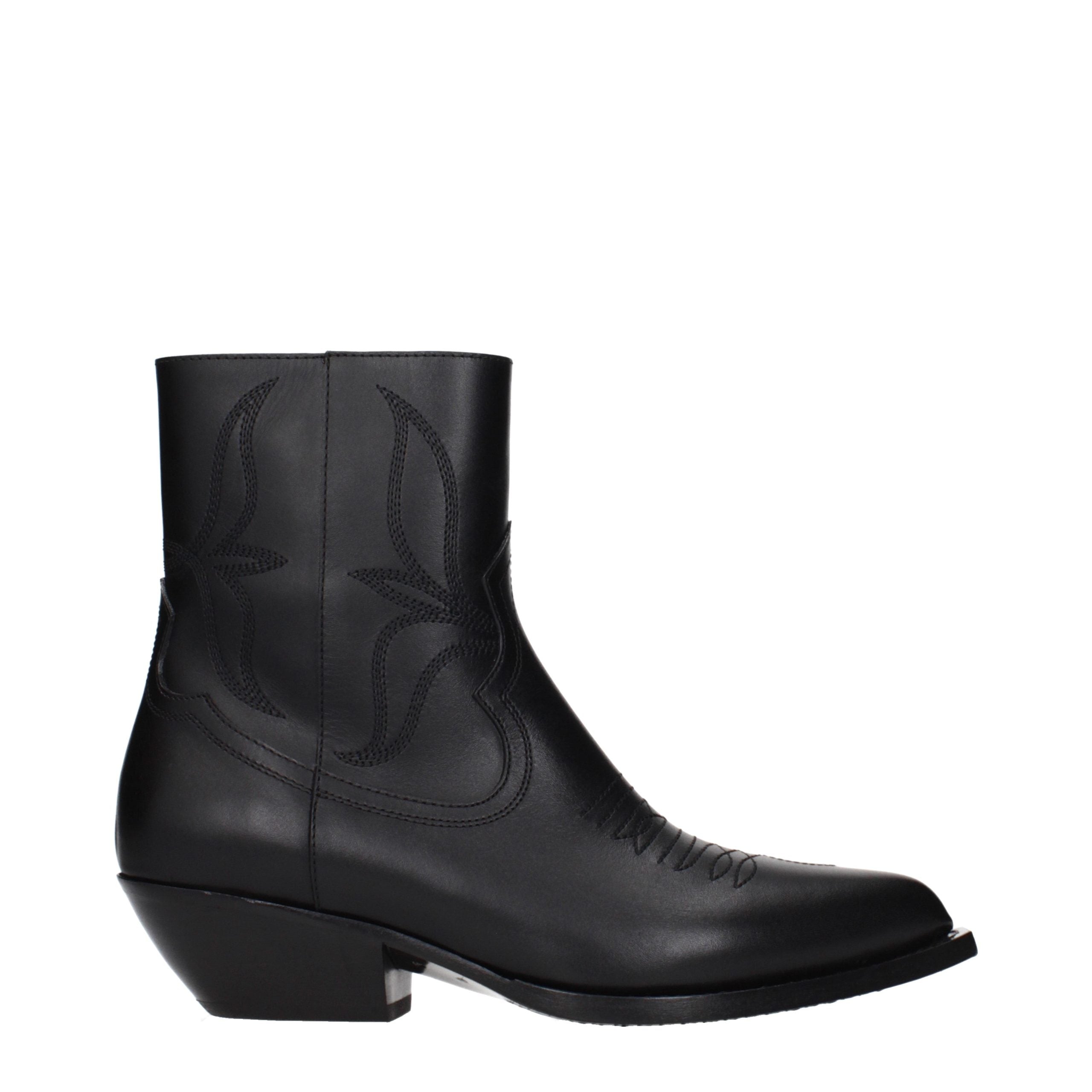 Bottes ankle en cuir noir de Celine, style élégant, avec talon et fermeture éclair sur le côté, pour un look sophistiqué.