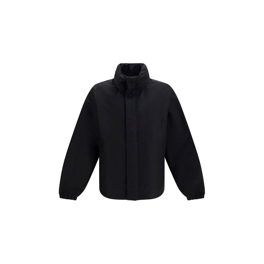 Veste longue noire en coton de Gucci, vue en gros plan, avec détails de couture et logo distinctif.