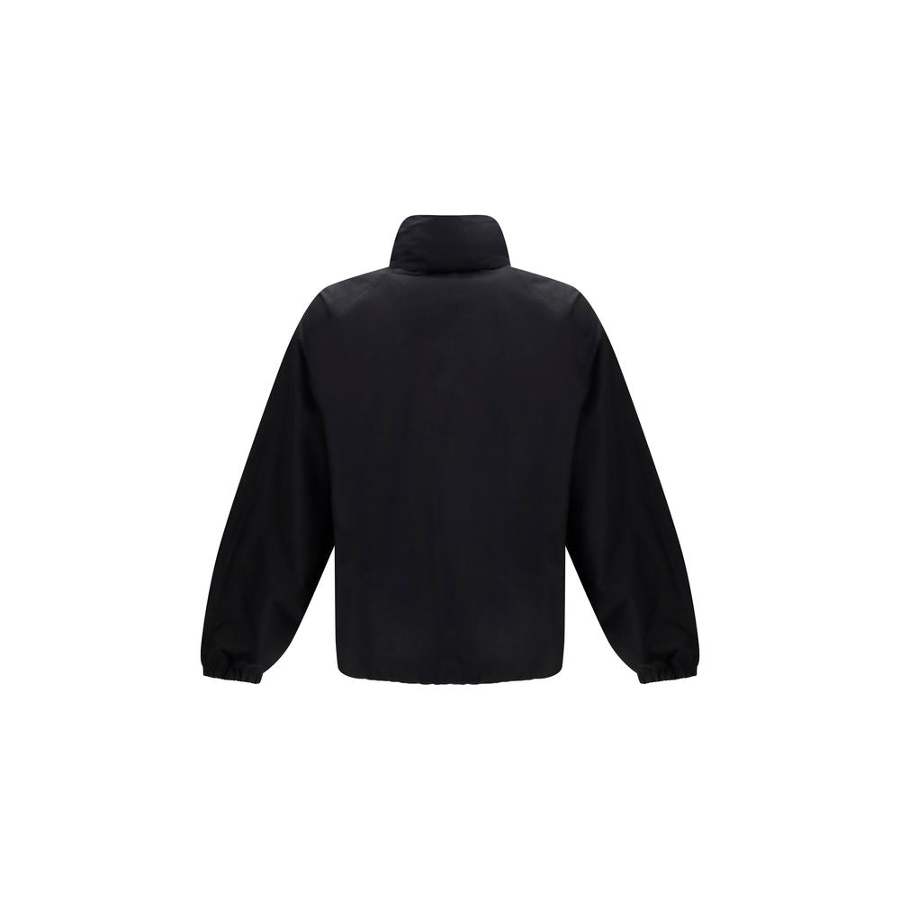 Veste longue en coton noir de Gucci, style élégant, avec détails de design visibles sur l’image.