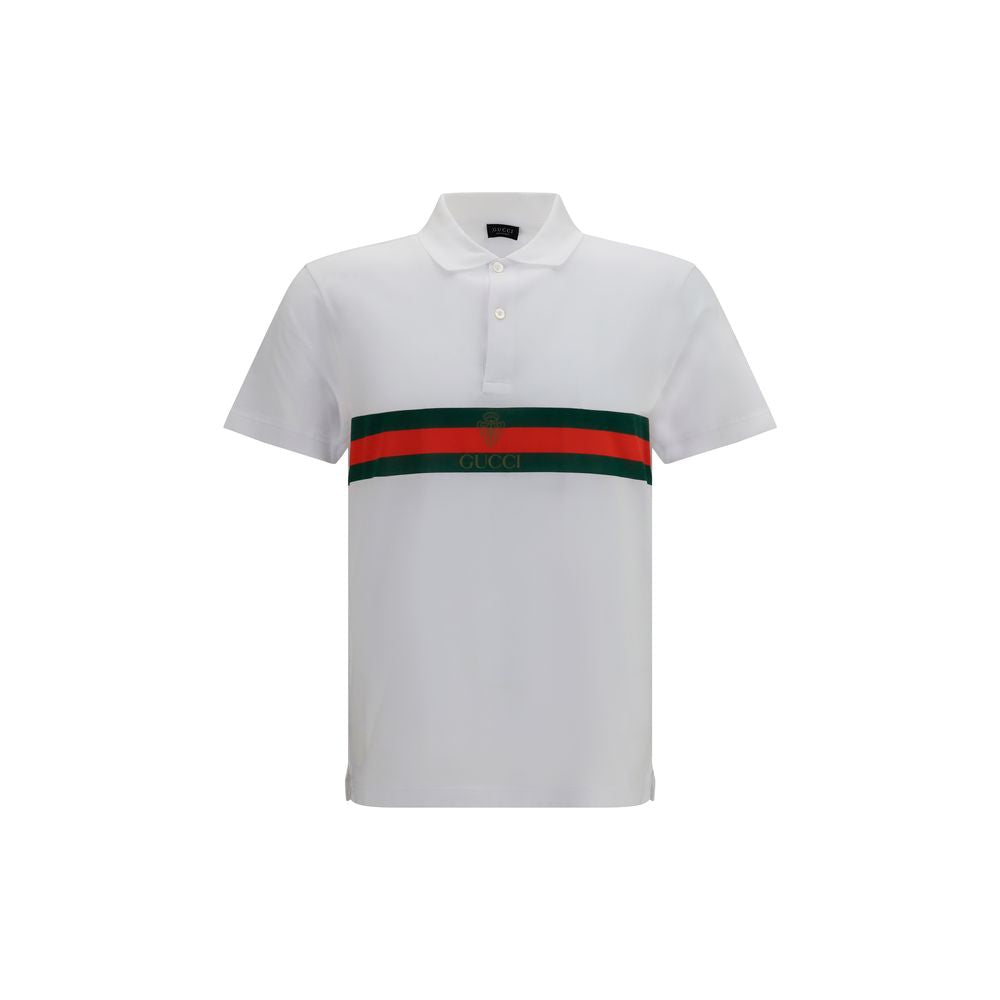 Chemise polo en coton blanc Gucci, vue rapprochée montrant le col, les boutons et le logo discret sur la poitrine.