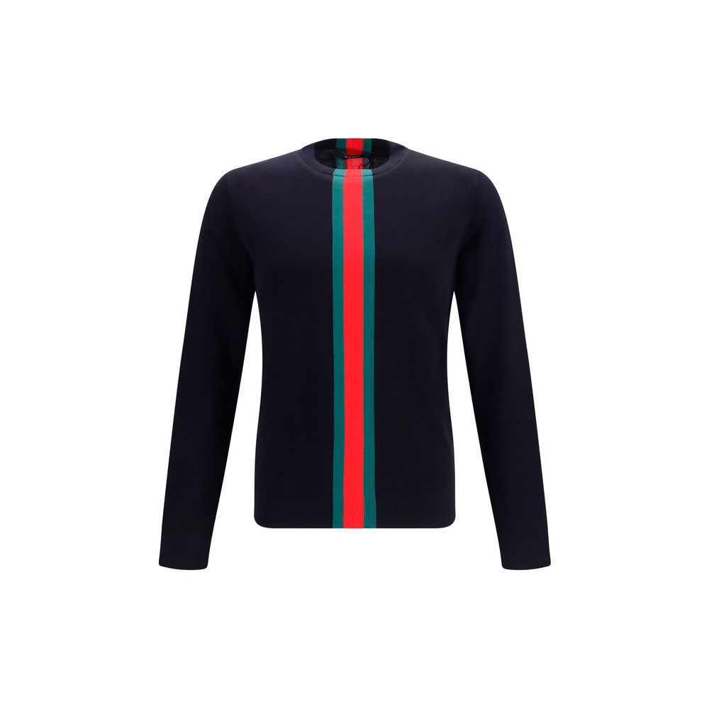 Sweatshirt en coton bleu Gucci pour homme, avec logo et design décontracté, porté dans un look casual.