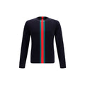 Sweatshirt en coton bleu Gucci pour homme, avec logo et design décontracté, porté dans un look casual.