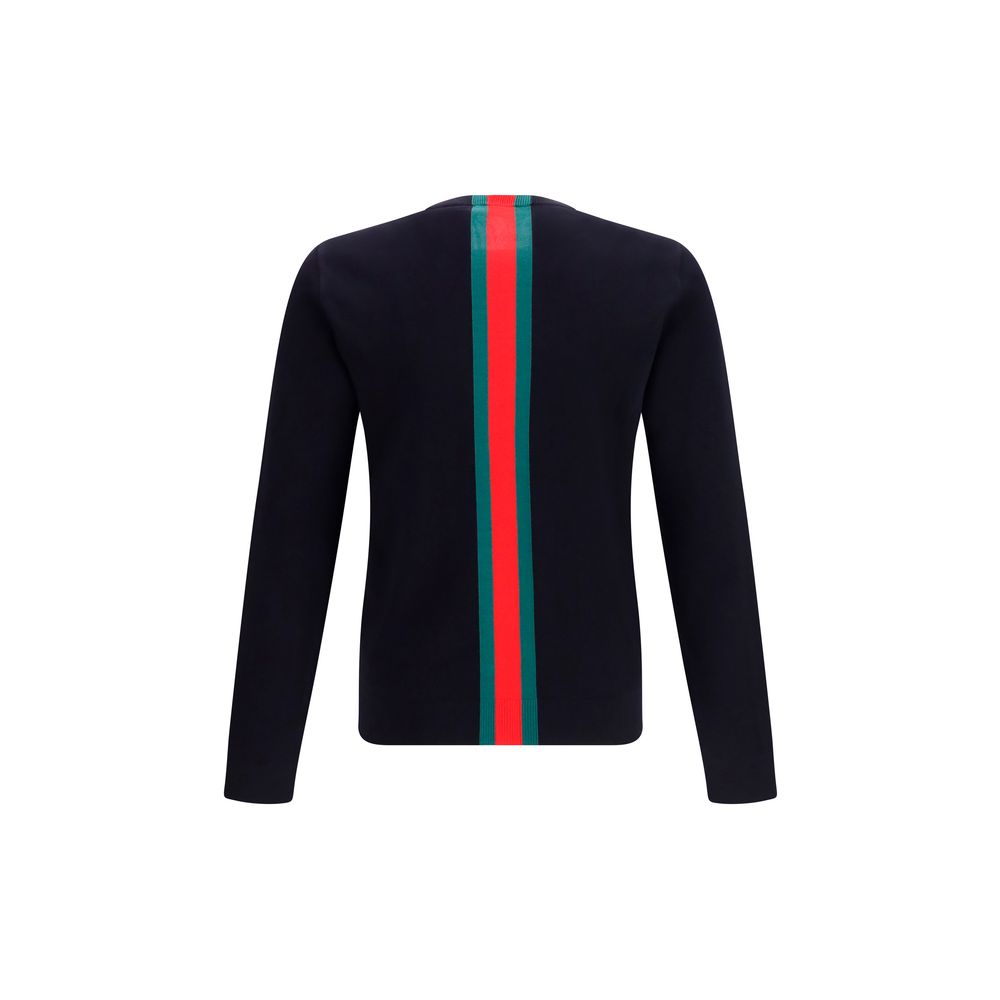 Sweat-shirt en coton bleu Gucci, style décontracté avec logo Gucci visible sur la poitrine, pour homme ou femme.