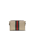 Sac à bandoulière en coton beige Gucci, sac à main élégant avec logo Gucci visible sur le devant.