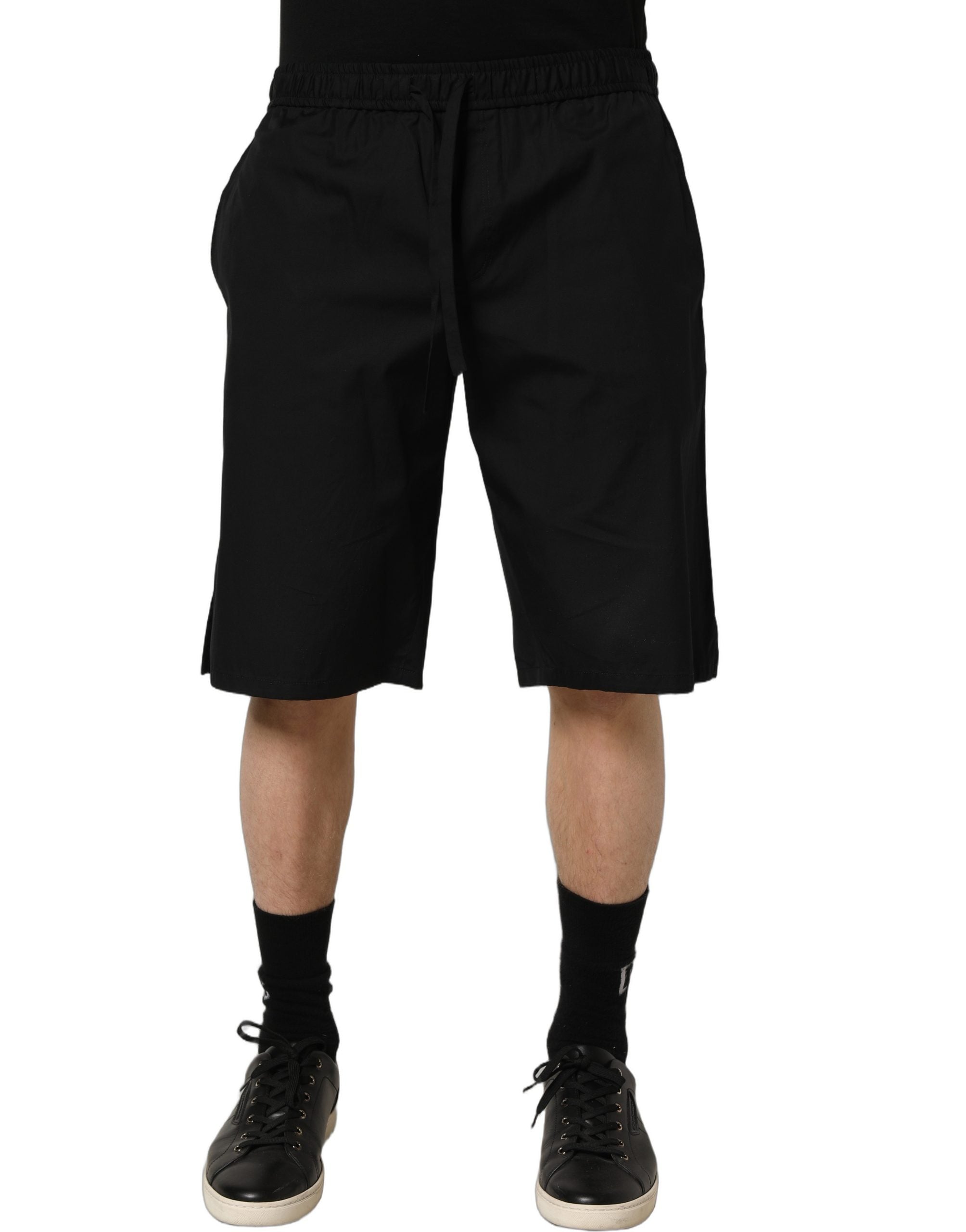 Shorts homme Dolce & Gabbana en coton noir, bermudas décontractés avec logo Dolce & Gabbana visible.