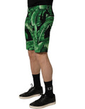 Shorts bermuda pour homme Dolce & Gabbana en tissu à motif bananier noir et vert, avec design moderne et détails élégants.