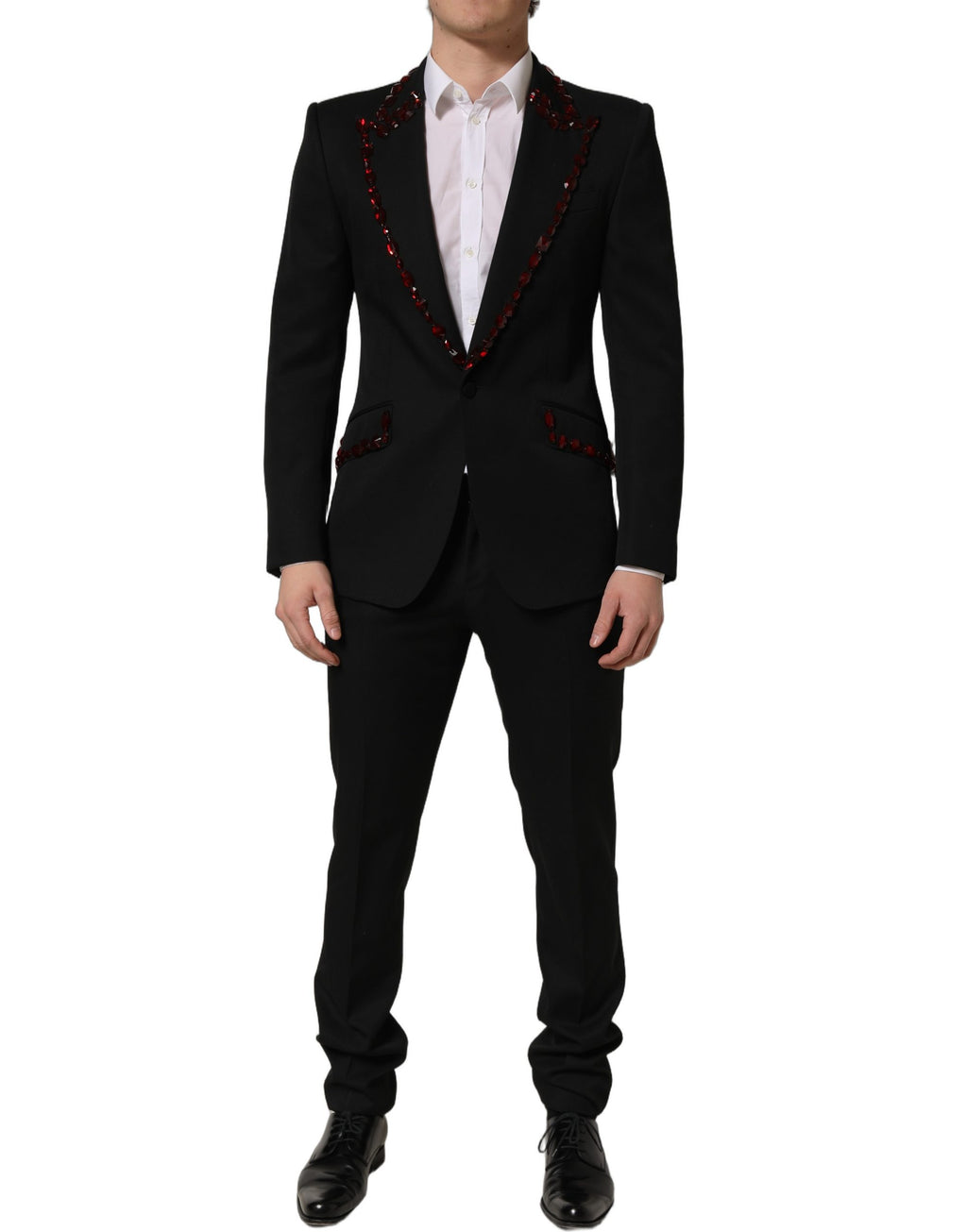 Costume en laine noire Dolce & Gabbana avec cristaux, composé de deux pièces élégantes et sophistiquées.