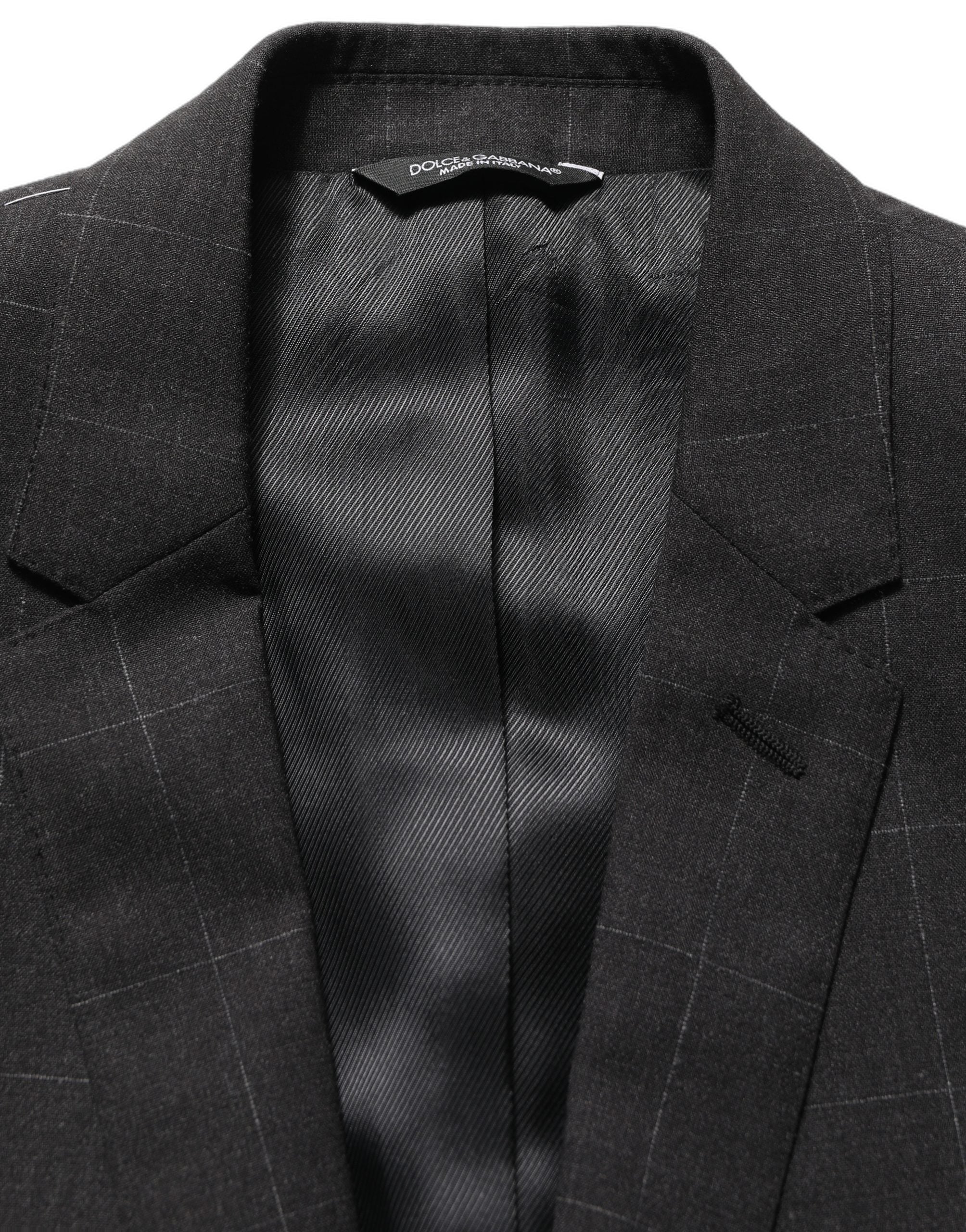Costume homme en laine noire Dolce & Gabbana, costume deux pièces ajusté pour occasions formelles, style élégant et moderne.