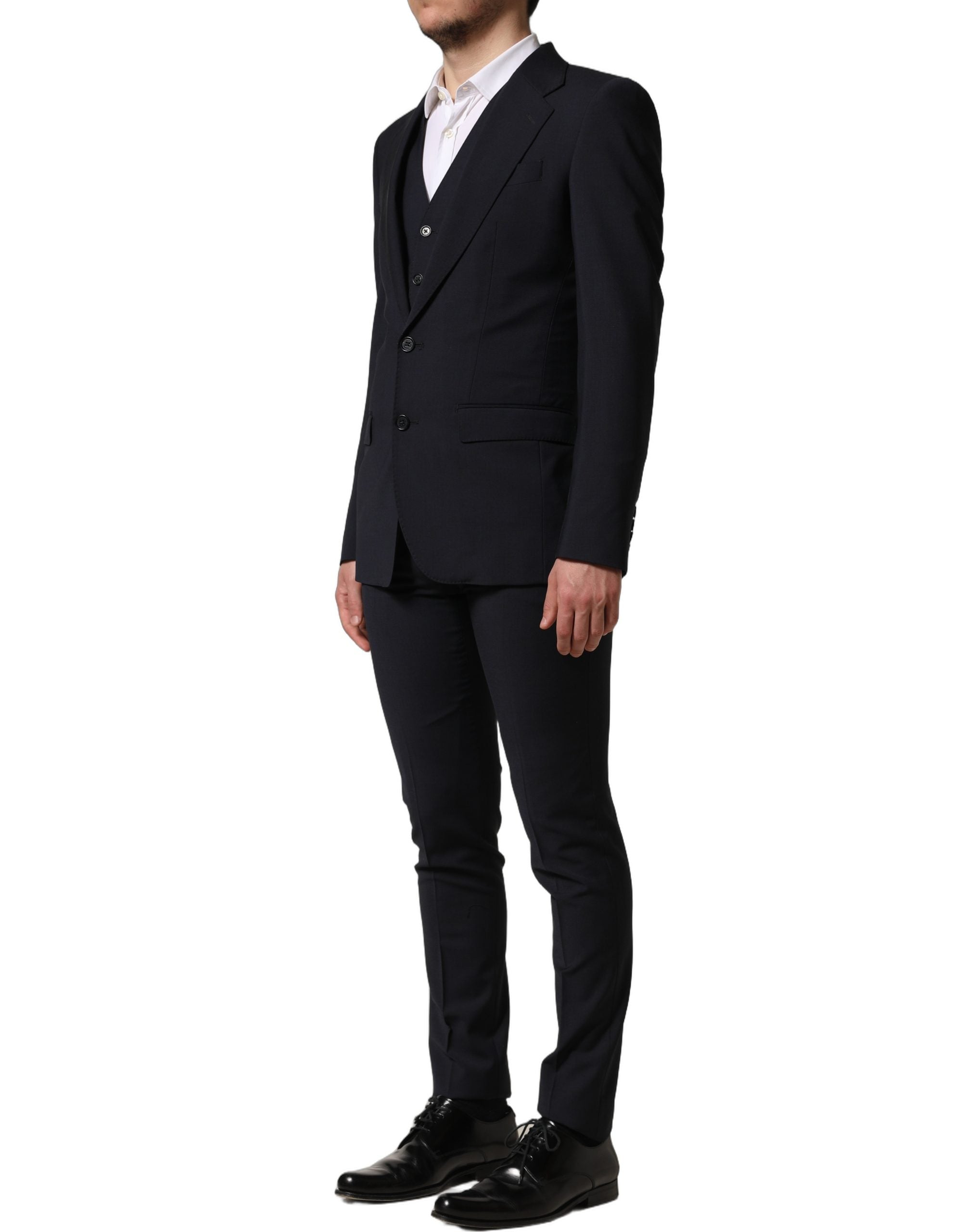 Costume homme noir en laine Dolce & Gabbana, costume trois pièces ajusté pour occasions formelles, vue de face.