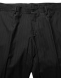 Costume trois pièces Dolce & Gabbana à rayures noires, coupe ajustée formelle avec veste, gilet et pantalons élégants.