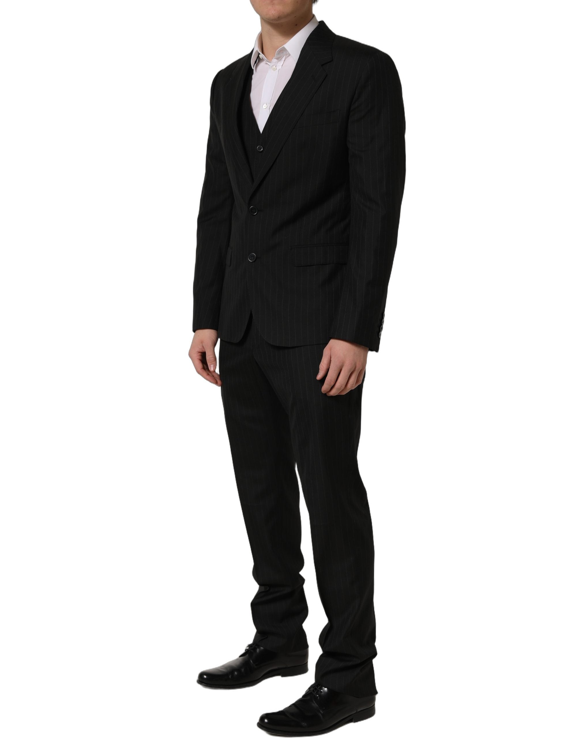 Costume noir Dolce & Gabbana à rayures, costume trois pièces ajusté pour homme, élégant et formel.