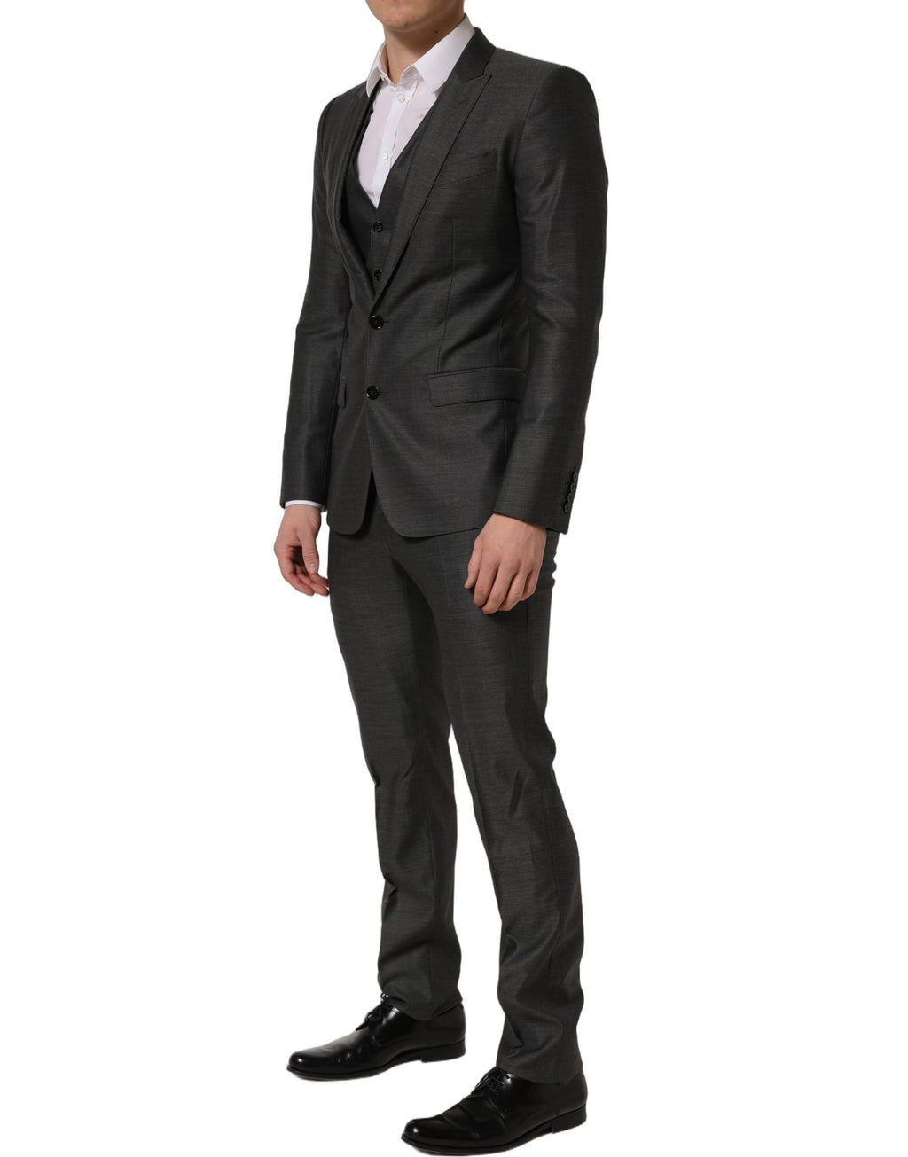 Costume trois pièces gris Dolce & Gabbana Martini, coupe slim fit, pour occasion formelle, visible détails du tissu et de la veste.