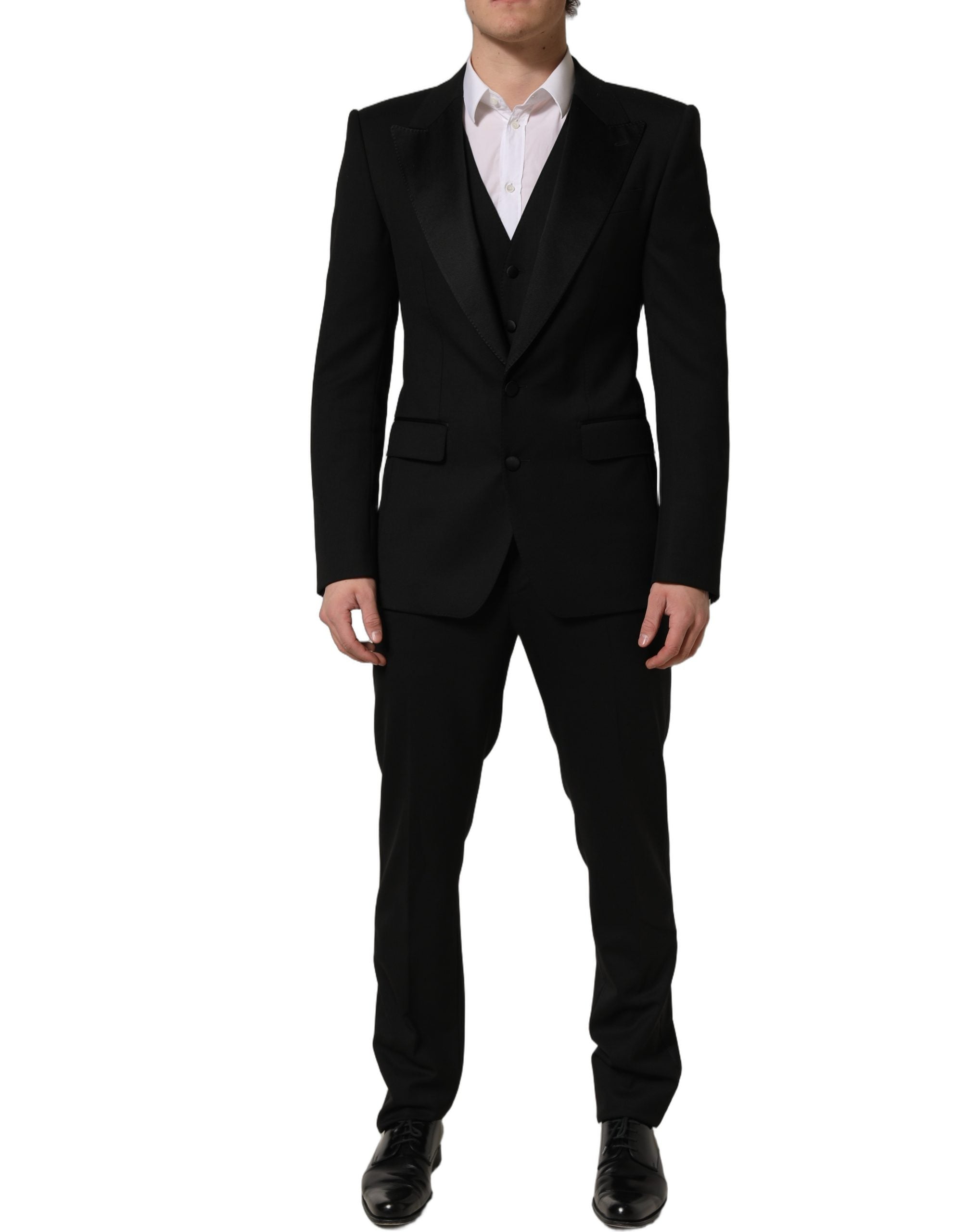 Costume homme Dolce & Gabbana en laine noire, costume trois pièces ajusté pour occasion formelle.