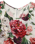 Robe courte sans manches Dolce & Gabbana blanche à motifs floraux, coupe ajustée et élégante, parfaite pour une occasion spéciale.